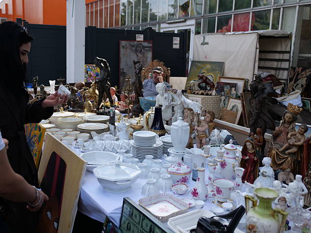 flea market stall white porcelain dishes figurines cherubs statues for sale, assorted vintage ceramics, second hand table wares