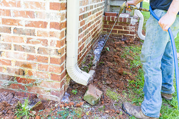 Termite treatment on the foundation of a house.