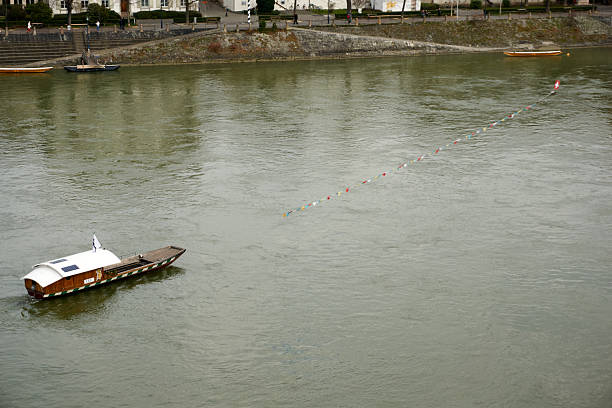 Ships passing Düsseldorf on the river Rhine with an exceptional low water level during a long period of drought in the summer of 2022.