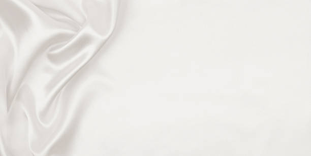 istock Smooth elegant golden silk or satin luxury cloth texture as wedding background. Luxurious background design. In Sepia toned. Retro style 2251623199