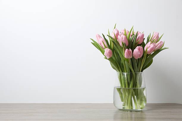 istock Beautiful pink tulips in a vase 2251627345