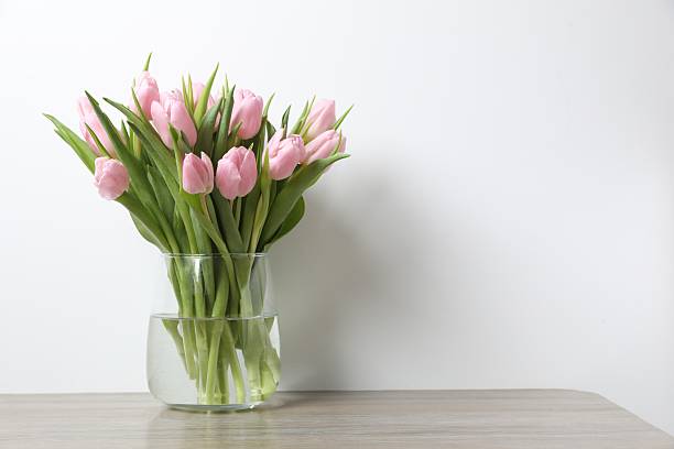 istock Beautiful pink tulips in a vase 2251627386