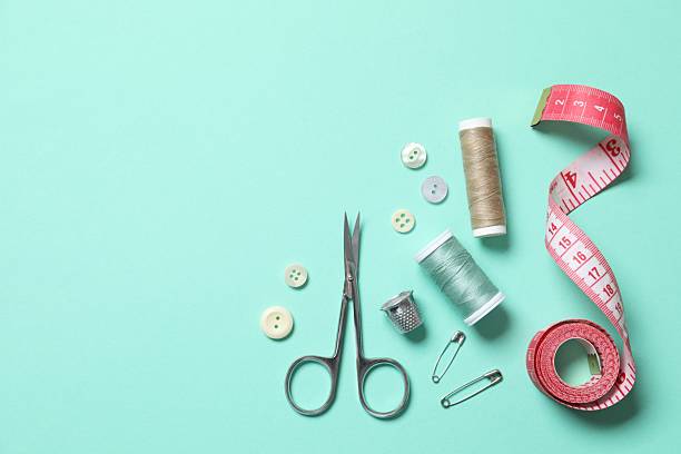 Flat lay composition with different sewing supplies on color background