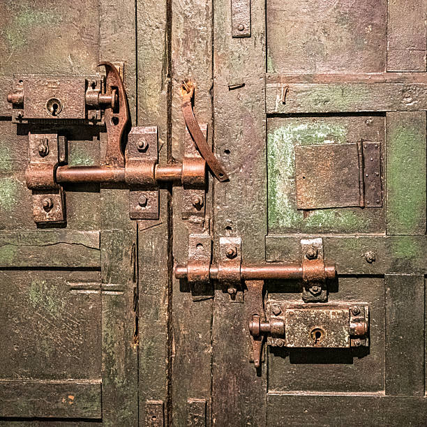 Rusty Iron Locks on Aged Wooden Door