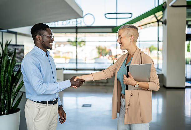 istock Business professionals shaking hands reaching agreement 2251632460