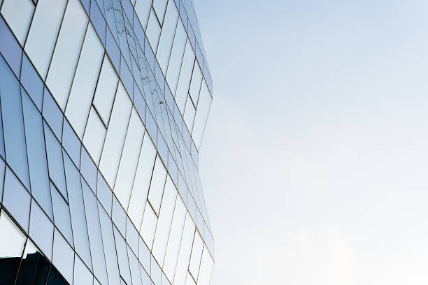 istock Modern Glass Office Building Against Sky 2251636340