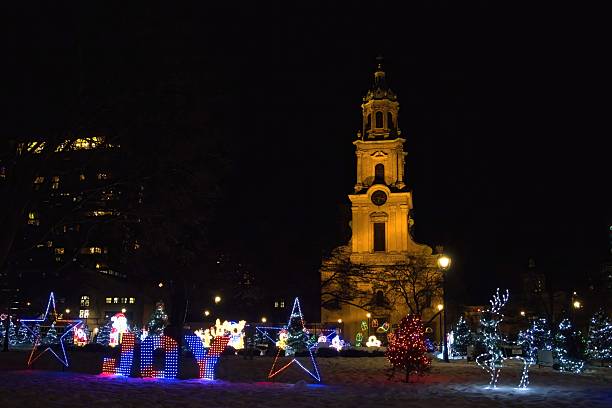 Milwaukee, Wisconsin, USA – December 11, 2025: Cathedral Square in Downtown Milwaukee beside the Cathedral of St. John the Evangelist, is festively decorated with a lighted walk through holiday display.