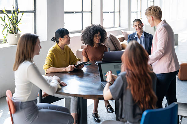 istock Businesswomen collaborating on project in modern office 2251640276