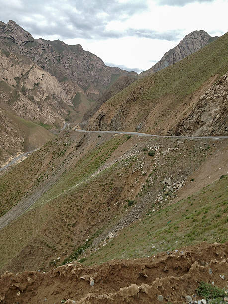 istock Mountainous Terrain with Winding Road in Dramatic Landscape 2251644513