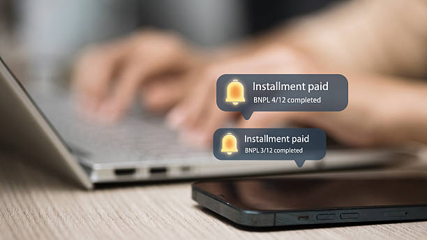istock Digital BNPL Payment Notification, Installment Paid Message on Smartphone and Laptop 2251645068