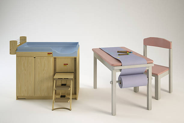 Changing table with steps and a kids art table with chair.