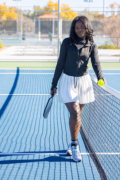 istock Beautiful Woman Playing Pickleball 2251657680