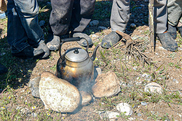 Shepherds boiling water for tea in the stone quarry
