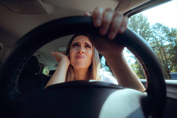 istock Driver Upset Over Noise Pollution Covers Her Ears 2251659210