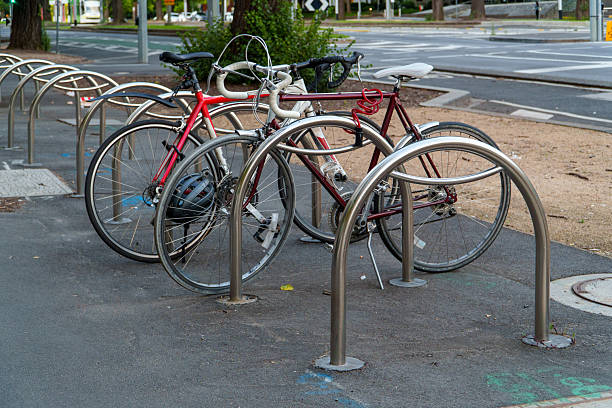 Empty bicycle rack in sunlight with shadows.