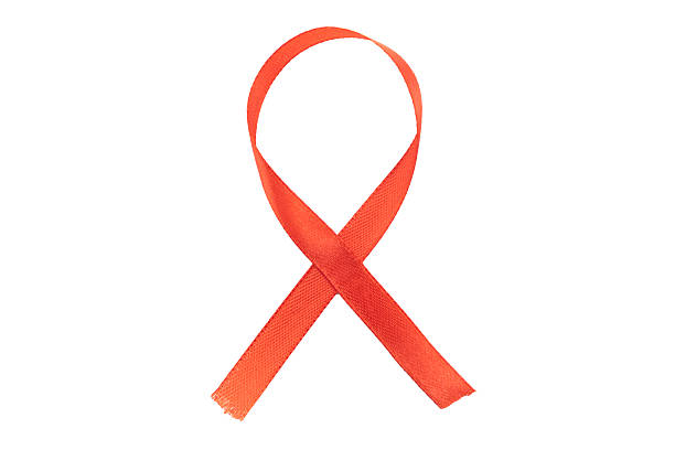 istock A bright red satin awareness ribbon is presented vertically, isolated on a clean white background. This universal symbol represents solidarity in the fight against HIV/AIDS. 2251661448