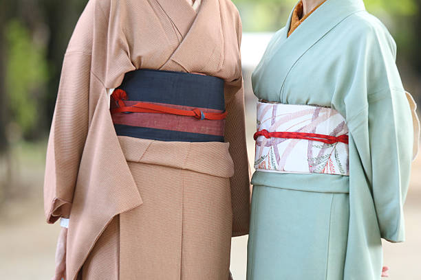 Yokohama, Kanagawa Prefecture, Japan - January 14, 2019: Japanese young people on the street on Coming of Age Day (Seijin No Hi 成人の日). This holday celebrate those who become twenty years of age. Most female participants wear colorful kimono. Males tend to prefer wearing business suits, though some wear traditional clothing.