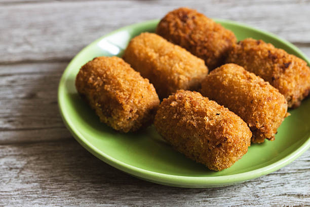 istock Crispy Homemade Croquettes on a Green Plate 2251665833