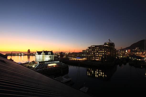 istock Sunset over Waterfront Architecture and Calm Harbor Reflections at Dusk 2251666844
