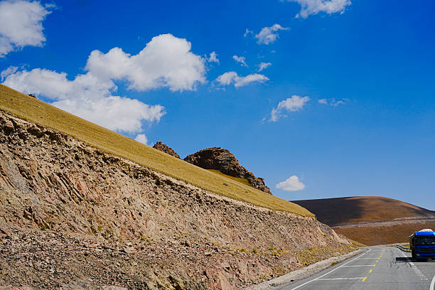 A sunny summer, a vast panoramic view of alpine meadows and natural grasslands.