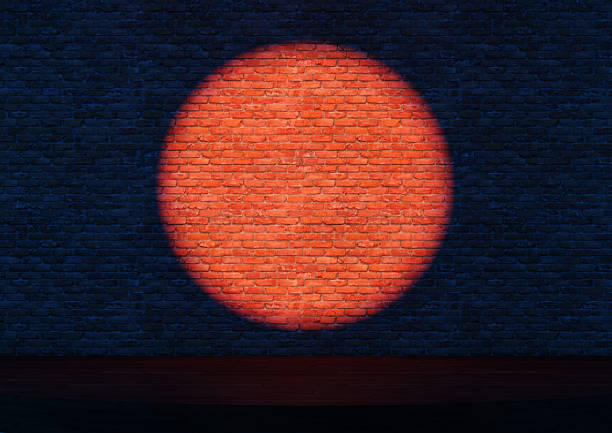 Empty stand-up stage with a spotlights. A bright round light is cast on a dark brick wall. 3d illustration