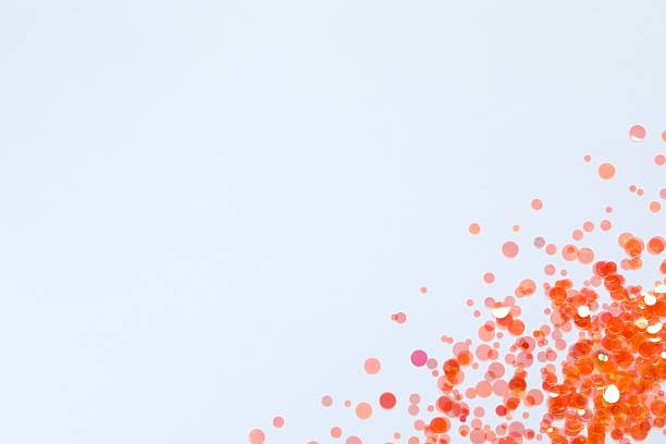 istock Beautiful orange confetti on a white background 2251679850