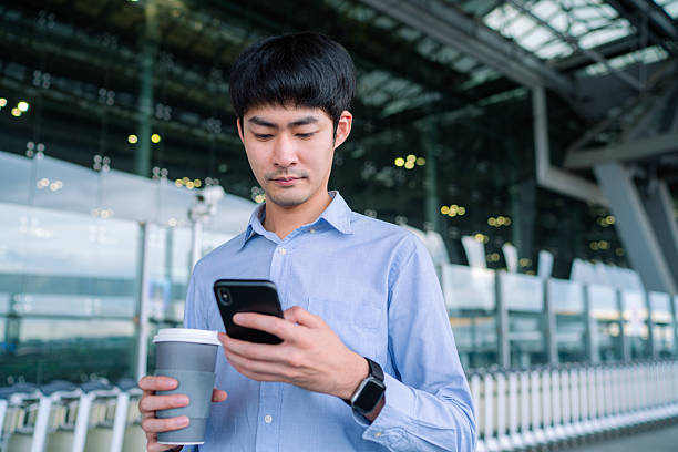 istock Freelancer man Requesting and Waiting Uber From A Smart Phone 2251680938
