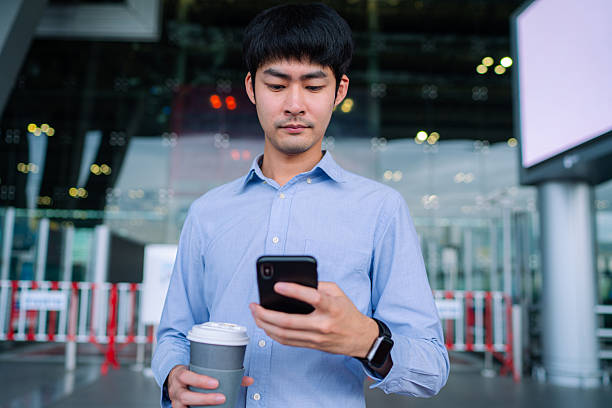 istock Freelancer man Requesting and Waiting Uber From A Smart Phone 2251680952
