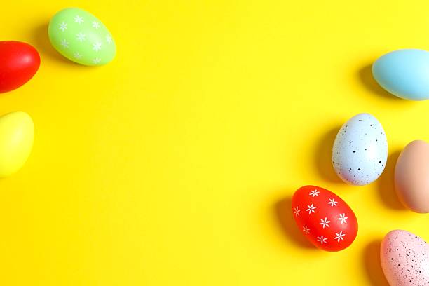 istock Happy Easter. Colorful eggs on color background, space for text or advertising 2251687745