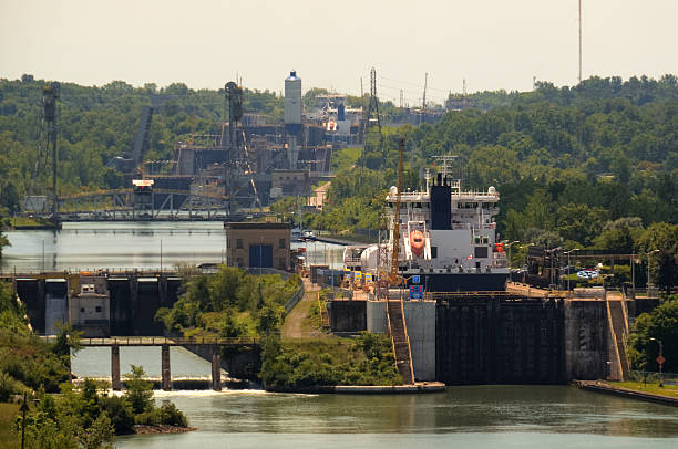 A ship is being raised in Lock 3 of the Welland Canal. Several more canal locks can be seen in the background. Lock 3 is located between St. Catharines and Niagara Falls, just south of the Garden City Skyway.