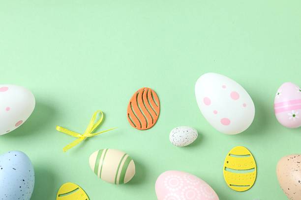 istock Happy Easter. Colorful eggs on color background, space for text or advertising 2251689679