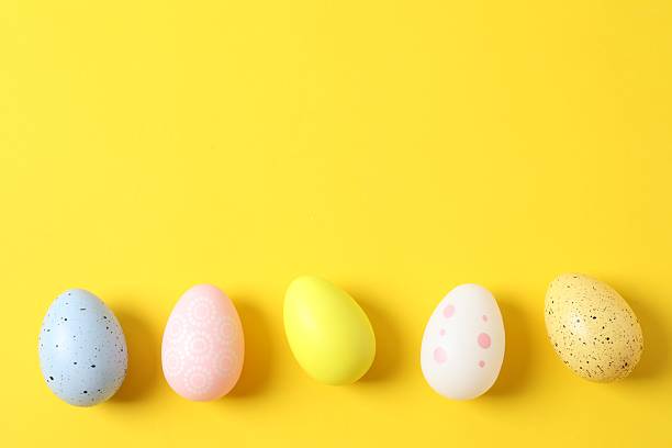 istock Happy Easter. Colorful eggs on color background, space for text or advertising 2251689705