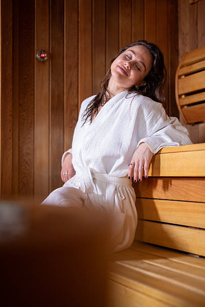 istock Woman relaxing in sauna enjoying wellness and self-care. Stock image 2251690607