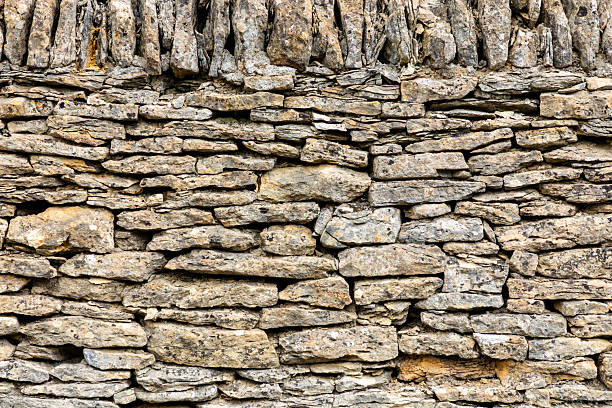 istock Rugged dry stone wall built from local stone in Cotswold for rustic outdoor setting 2251693850