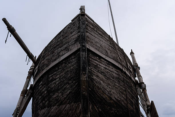 istock Close-up of Dark Shipwreck Stern Texture Against Overcast Sky. 2251695761