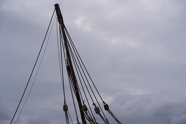 Detailed Ship Mast and Rigging Against the Sky.