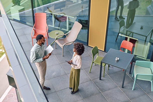 istock Business people discussing work on modern office balcony 2251696903