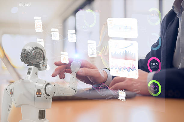 istock Man and AI humanoid robot using laptop work together and collaborating AI agent work with AI Financial management technology.Advisor using KPI Dashboard on virtual screen working with robot 2251703615