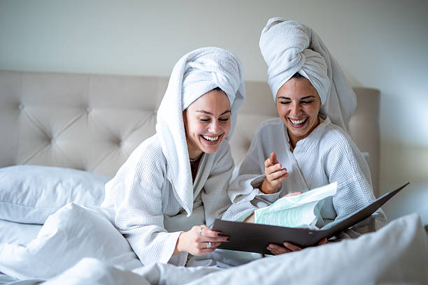 istock Women friends laughing during relaxing spa weekend. Stock image 2251703937