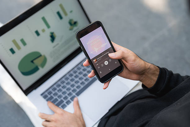 istock Young man smiling at his smartphone while listening to mindfulness podcast 2251704023