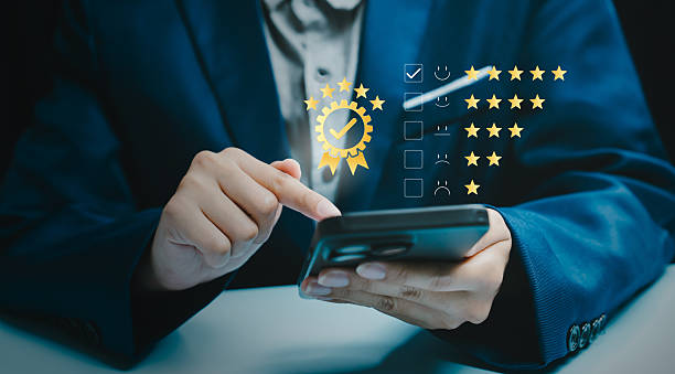 istock Quality assurance concept, businessman checking five star evaluation list on smartphone, compliance verification, performance standard, service excellence, audit control, customer trust. 2251704943