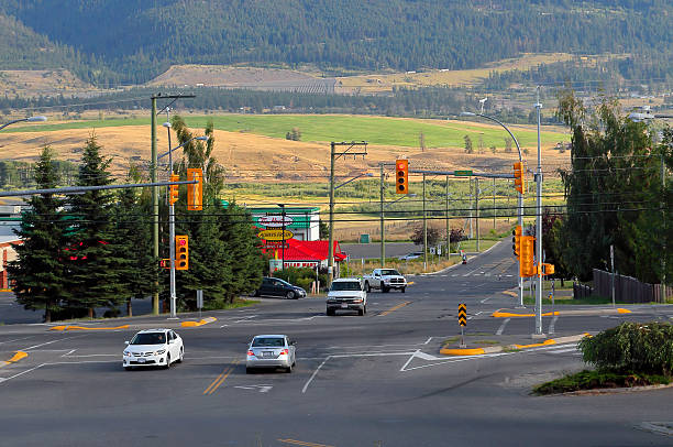 Merritt, Canada - August 12, 2011: City traffic at a traffic signal intersection in central Merritt