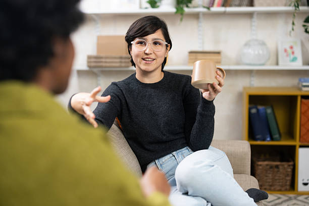 istock Women friends talking discussing ideas having coffee 2251710951
