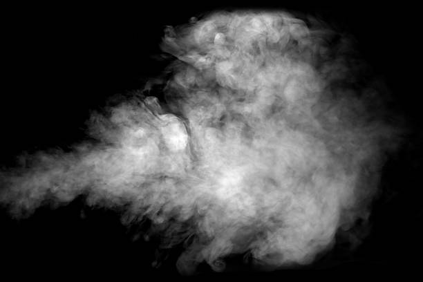 istock Dense white smoke drifting on a dark background creates a dramatic atmospheric texture, ideal for design overlays, cinematic effects, and creative compositions needing mist, fog, or vapor elements. 2251712062