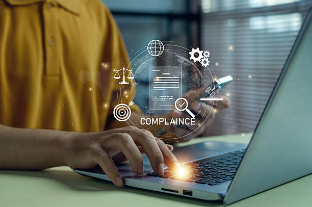 istock Business compliance officer using laptop and smartphone with digital audit, data security, regulation and quality control icons, representing modern corporate governance technology. 2251712379