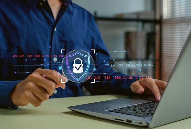 istock person using a laptop with a futuristic cybersecurity interface, highlighting data protection, secure access, digital privacy, and modern technology solutions for online security. 2251712416