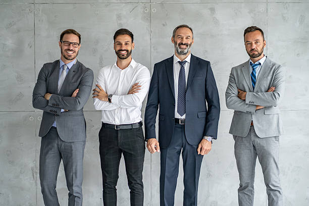 istock Dynamic Team of Men in Suits Showing Confidence Together 2251712469