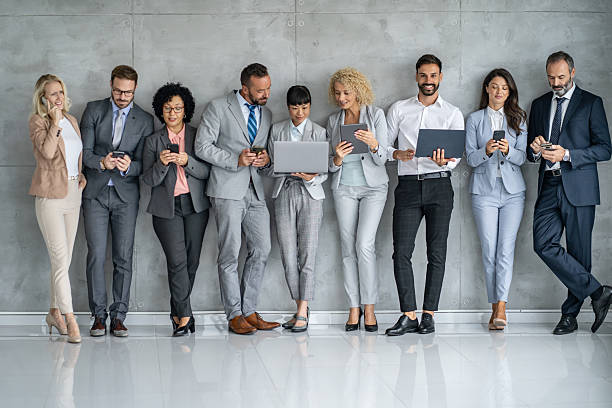istock Stylish Professionals Engaged With Their Technology Devices 2251712474