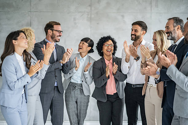 istock Energetic Office Group Engaging in Celebratory Applause 2251712488