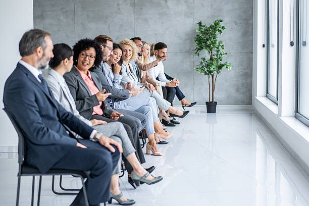 istock Group of Professionals Engaged in Conversation and Thought 2251712500